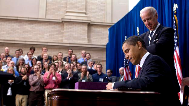 President Obama signs the American Recovery and Reinvestment Act as Vice President Biden watches in Denver, Colo. on Feb. 17, 2009 (White House photo by Pete Souza).